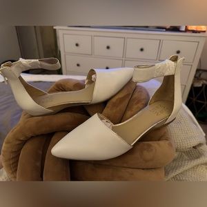 White flats with a trim of gold, never worn!